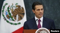FILE - Mexico's President Enrique Pena Nieto talks during an official swearing-in ceremony for new ministers at the Los Pinos official residence in Mexico City, Aug. 27, 2015.