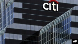 FILE - A Citibank sign in Chicago. 