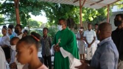 FILE - Catholic priest Jean-Nicaisse Milien walks to give a Mass in Port-au-Prince, Haiti, Nov. 7, 2021.