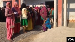 Women in Uttar Pradesh turn out enthusiastically to vote, but many cast ballots as they are instructed to by men in the family. (A. Pasricha/VOA)