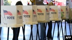 Citizens vote on Election Day at a fire station in Alhambra, Los Angeles County, California, Nov. 6, 2012.