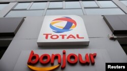 The logo of French oil and gas company Total is seen at a petrol station in Paris, France, February 8, 2021. REUTERS/Sarah Meyssonnier