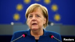 German Chancellor Angela Merkel addresses the European Parliament during a debate on the future of Europe, at the European Parliament in Strasbourg, France, Nov. 13, 2018.