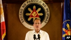 FILE - Philippine President Benigno Aquino III addresses the nation in a live broadcast from the Presidential Palace in Manila, July 14, 2014. 