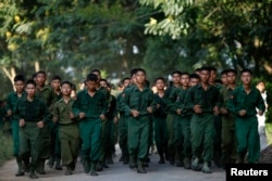 FILE - Military cadets of the Defense Services Academy exercise around their compound in Pyin Oo Lwin, Myanmar, Sept. 21, 2012. About 8,000 votes in the town are expected to come from within the Defense Services Academy. ​