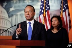 Rep. Luis Gutierrez, D-IIli, left, with Rep. Norma Torres, D-Calif., speaks during a news conference about the court-ordered deadline to reunify immigrant families who were separated at the border, Wednesday, July 25, 2018, on Capitol Hill in Washington.