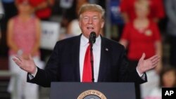 President Donald Trump speaks at a rally endorsing the Republican ticket in Erie, Pennsylvania, Oct. 10, 2018.