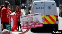 FILE - A Pro-Life campaigner demonstrates outside the Irish Parliament ahead of a vote to allow limited abortion in Ireland, Dublin, July 10, 2013. A Belfast High Court ruling is expected to ease Northern Ireland's strict anti-abortion laws to make it easier for women to terminate pregnancies in some cases.