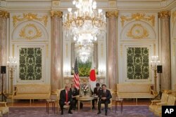 U.S. President Donald Trump, left, meets with Japanese Prime Minister Shinzo Abe at Akasaka Palace, Japanese state guest house in Tokyo, Monday, May 27, 2019.