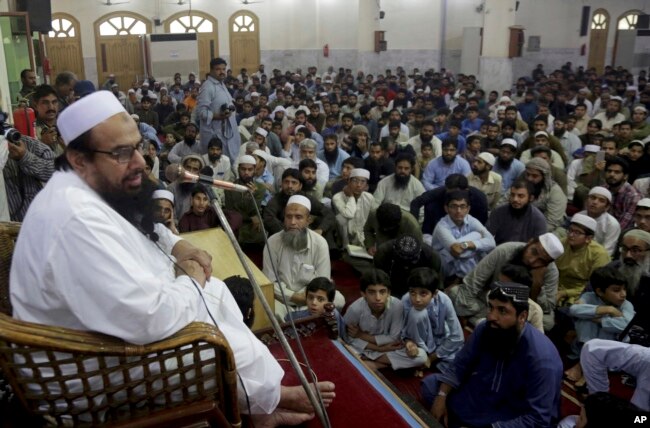 Pakistani cleric Hafiz Saeed, the founder of the outlawed Lashkar-e-Taiba group, which was blamed for the 2008 Mumbai attacks that killed 166 people, addresses at a mosque in Lahore, Pakistan, Nov. 1, 2018.
