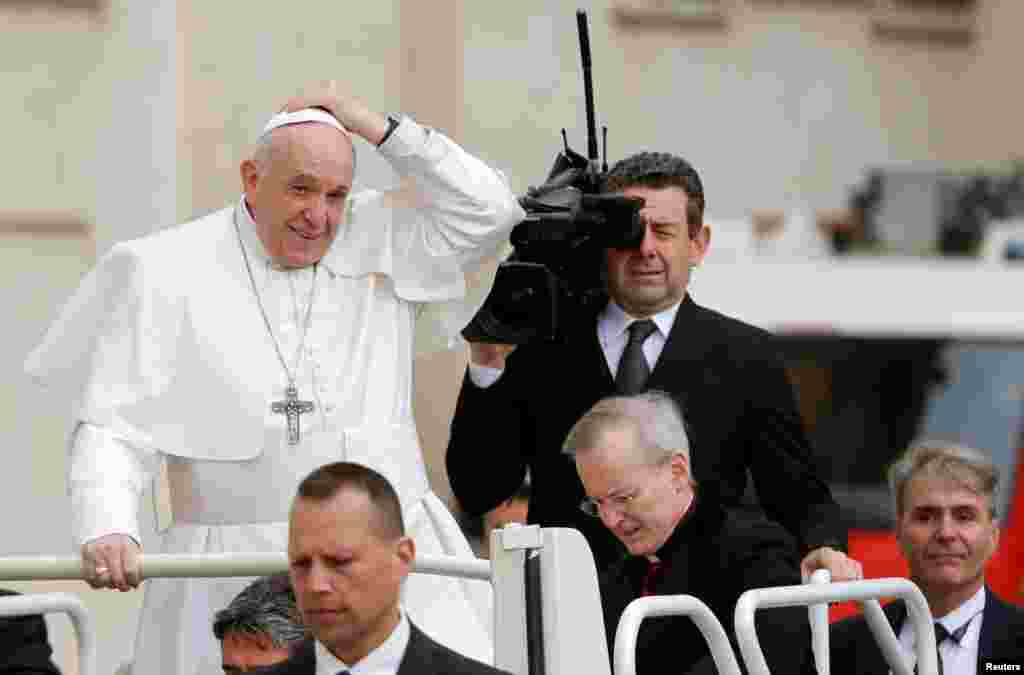 Pope Francis arrives to lead the Wednesday general audience in Saint Peter&#39;s Square at the Vatican.