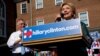 Democratic presidential candidate Hillary Clinton takes the stage for a rally with Virginia Governor Terry McAuliffe in Alexandria, Virginia, Oct. 23, 2015.