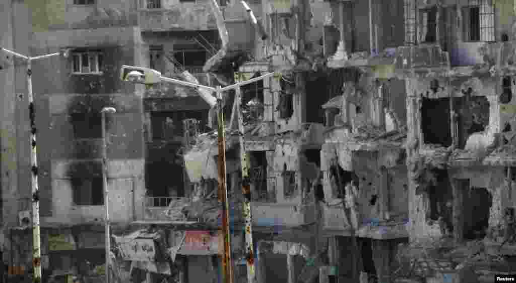 Buildings damaged by shelling in the Al-Khalidiya neighborhood of Homs, March 10, 2013. 