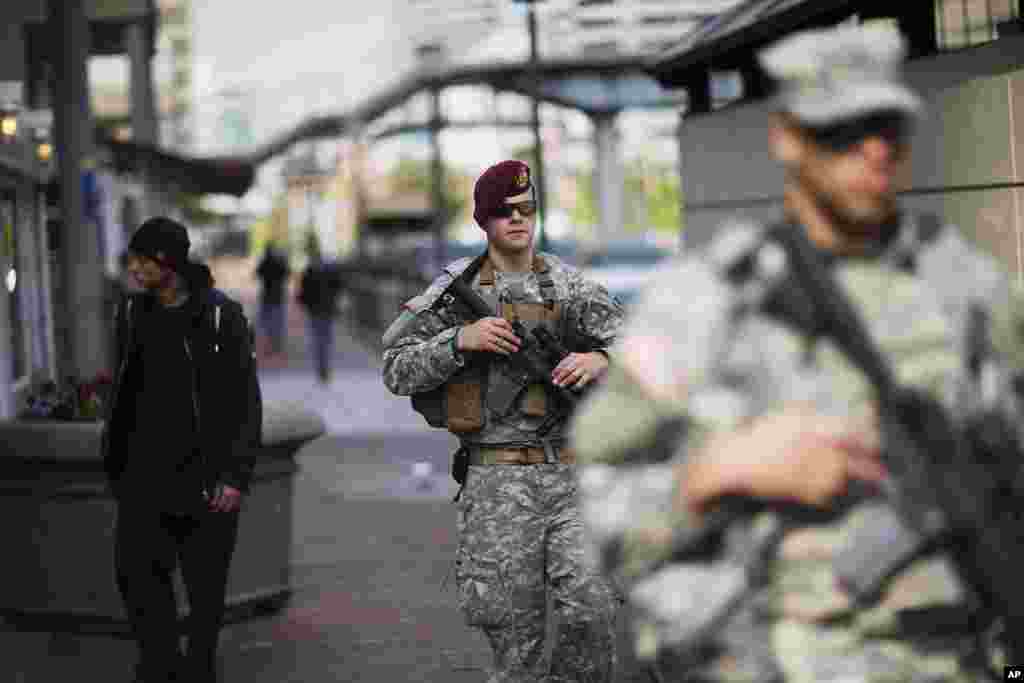 Members of the National Guard patrol along Baltimore&#39;s Inner Harbor area in the aftermath of rioting following Monday&#39;s funeral for Freddie Gray, who died in police custody in the Maryland city.