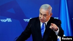 FILE - Israel's Prime Minister Benjamin Netanyahu gestures as he speaks during a news conference in Jerusalem, April 1, 2019.