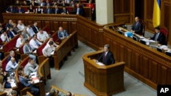 FILE - Ukrainian President Petro Poroshenko is seen speaking to lawmakers in the Parliament of Ukraine, in Kyiv, in a June 4, 2015, photo.