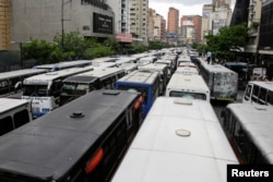 Buses blocking an avenue are seen during a public transport protest in Caracas, Venezuela, Sept. 21, 2016.