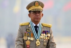 FILE - Myanmar's junta chief Senior General Min Aung Hlaing, who ousted the elected government in a coup, presides at an army parade on Armed Forces Day in Naypyitaw, Myanmar, March 27, 2021. (Reuters)