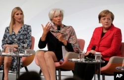 FILE - Ivanka Trump, daughter and adviser of U.S. President Donald Trump, International Monetary Fund Managing Director Christine Lagarde and German Chancellor Angela Merkel, from left, discuss during a panel of the W20 Summit in Berlin, April 25, 2017.