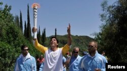 Giovane Gavio, do Brasil, na cerimónia de entrega da chama, Grécia, 21 de Abril.