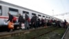People board a train at the station in Sid, about 100 km west from Belgrade, Serbia, Nov. 3, 2015. 