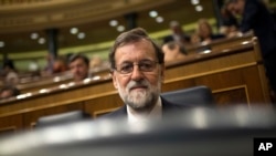 Spain's Prime Minister Mariano Rajoy sits during a weekly session at the Spanish parliament in Madrid, Nov. 15, 2017. Spain's prime minister says next year's economic growth could be adjusted strongly upward if normality returns to Catalonia following regional elections next month.