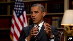 FILE - President Barack Obama speaks during an interview at the White House.