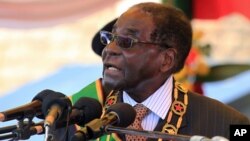 FILE: Zimbabwean President Robert Mugabe delivers his speech during a ceremony to honor thousands of fighters who died in the 1970s Bush war against colonialism, in Harare, Aug. 10, 2015.