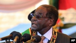 FILE - Zimbabwean President Robert Mugabe delivers his speech during a ceremony to honor thousands of fighters who died in the 1970s Bush war against colonialism, in Harare, Aug. 10, 2015.