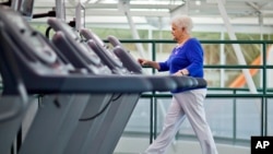 FILE - A woman with diabetes walks on a treadmill as part of an exercise program to help control the disease. Researchers who recently linked diabetes with cognitive and memory issues say keeping fit can help decrease the risk of vascular dementia in diabetics.