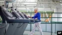 FILE - A diabetes patient walks on a treadmill as part of an exercise program to help control the disease.