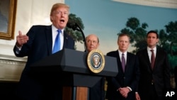 President Donald Trump speaks before signing a presidential memorandum on the imposition of tariffs and investment restrictions on China, in the Diplomatic Reception Room of the White House, March 22, 2018, in Washington. From left are Trump, Secretary of Commerce Wilbur Ross, U.S. Trade Representative Robert Lighthizer and White House homeland security adviser Tom Bossert.