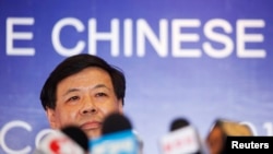 FILE - China's Vice Finance Minister Zhu Guangyao addresses the media during a news conference at a hotel in Los Cabos, Mexico.