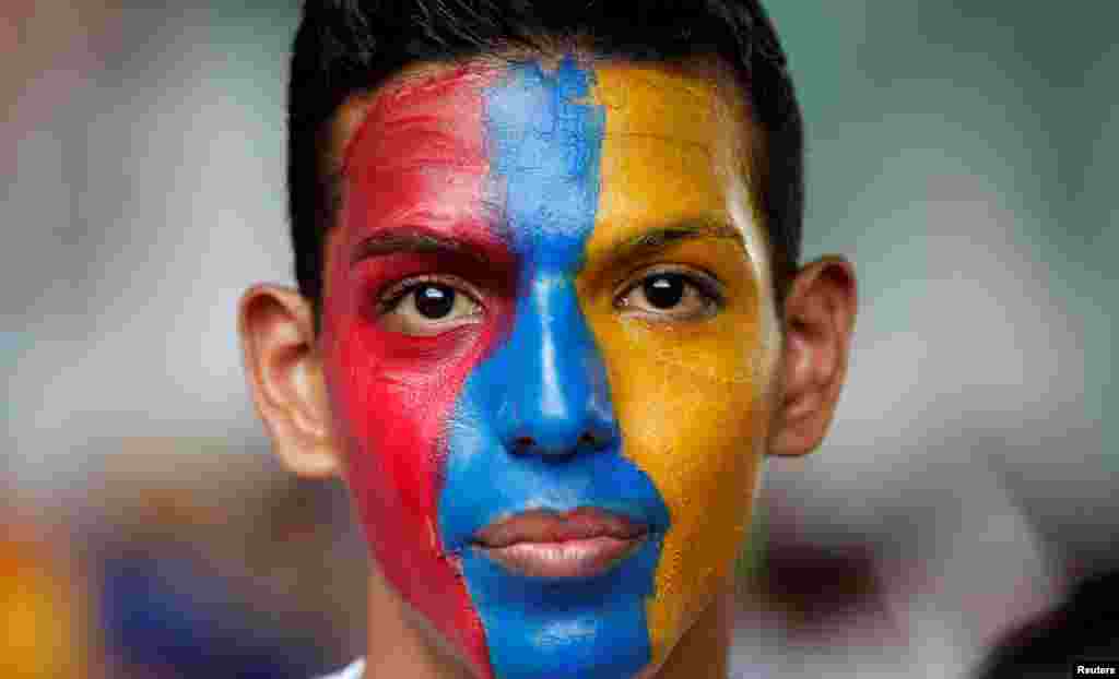 An opposition supporter participates in a rally against Venezuela's President Nicolas Maduro in Caracas, Venezuela.