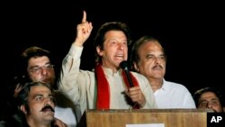 Pakistani cricketer-turned-politician Imran Khan delivers a speech during a protest in Islamabad, Pakistan, Aug. 18, 2014.