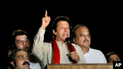 Pakistani cricketer-turned-politician Imran Khan delivers a speech during a protest in Islamabad, Pakistan, Aug. 18, 2014.