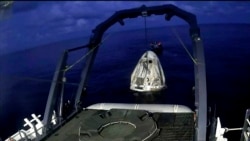 In this image taken from SpaceX video, a SpaceX capsule carrying four people is lifted from the Atlantic Ocean off the Florida coast onto a recovery vessel, Sept. 18, 2021.