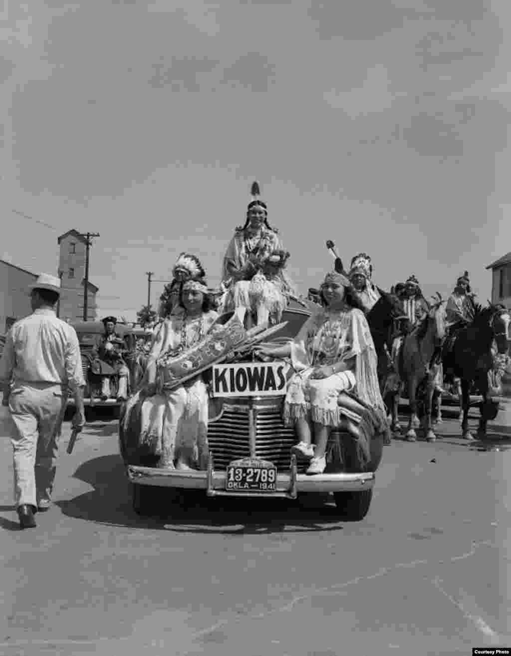 Left to right: Juanita Daugomah Ahtone (Kiowa), Evalou Ware Russell (center), Kiowa Tribal Princess, and Augustine Campbell Barsh (Kiowa) in the American Indian Exposition parade. Anadarko, Oklahoma, 1941. 45EP9. © 2014 Estate of Horace Poolaw. Reprinted