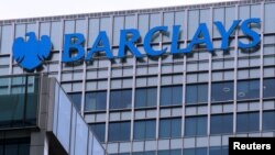 FILE - The logo of Barclays bank is seen at its office in the Canary Wharf business district of London, April 1, 2013.