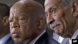 Rep. John Lewis, D-Ga., left, and Rep. John Conyers, D-Mich., right, co-chairs of the Civil Rights Taskforce of the Congressional Black Caucus, join other members of the House to express disappointment in the Supreme Court's decision on Shelby County v. H