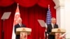 U.S. Vice President Mike Pence, left, and Singaporean Prime Minister Lee Hsien Loong speak at a joint press conference at the Istana or Presidential Palace in Singapore, Friday, Nov. 16, 2018.