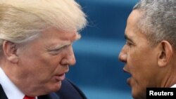 U.S. President Barack Obama, right, greets President-elect Donald Trump at inauguration ceremonies swearing in Trump as president on the West front of the U.S. Capitol in Washington, Jan. 20, 2017.