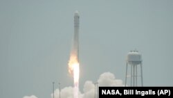 The Orbital Sciences Corporation Antares rocket launches with the Cygnus spacecraft on board from NASA's Wallops Flight Facility on Wallops Island, Virginia, July 13, 2014.