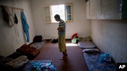 FILE - A man suspected of being a Gadhafi loyalist prays in a detention facility run by former rebel fighters in Misrata, Libya, Sept. 22, 2011. 