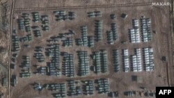 This handout satellite image released by Maxar Technologies and taken on November 1, 2021, shows the presence of a large ground forces deployment on the northern edge of the town of Yelnya, Smolensk Oblast, Russia. 