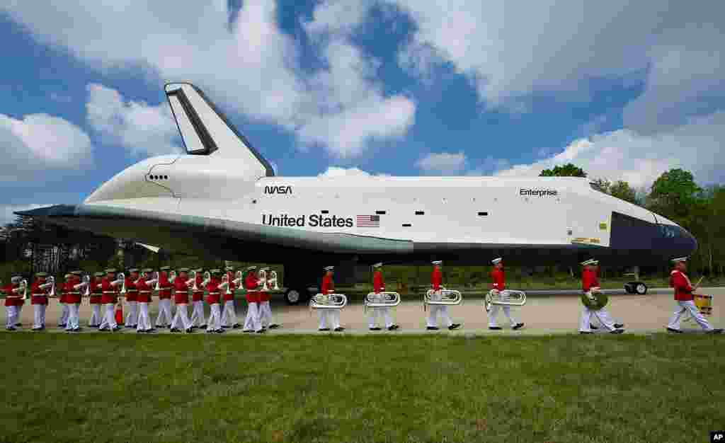 Space shuttle Enterprise is seen as the United States Marine Corp Drum and Bugle Corps and Color Guard march by at the Steven F. Udvar-Hazy Center in Chantilly. Enterprise will be transferred to the Intrepid Sea, Air and Space Museum in New York City. (NA