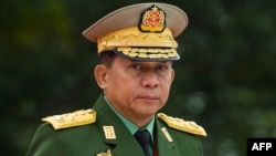 (FILES) In this file photo taken on July 19, 2018, Myanmar's Chief Senior General Min Aung Hlaing, commander-in-chief of the Myanmar armed forces, arrives to pay his respects to Myanmar independence hero General Aung San and eight others assassinated in 1
