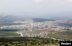 FILE - A general view shows the Kurdish city of Afrin, in Aleppo's countryside, Syria, March 18, 2015.