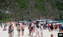 Tourists enjoy the beach at Maya Bay, Phi Phi leh island in Krabi province, Thailand, May 31, 2018.