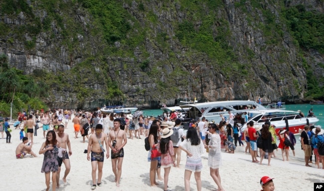 Tourists enjoy the beach at Maya Bay, Phi Phi leh island in Krabi province, Thailand, May 31, 2018.